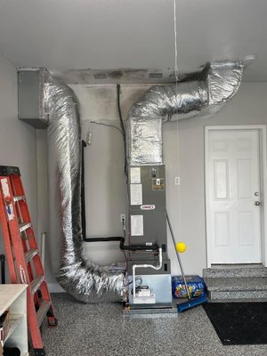 New Hvac unit in garage - Their old unit was hanging from the ceiling horizontal in the garage, and I moved it to the floor for easy service and maintenance New Hvac unit in garage - Their old unit was hanging from the ceiling horizontal in the garage, and I moved it to the floor for easy service and maintenance