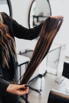 Haie Extensions - Luxury hair extensions are an intricate method that has minimal points of contact. Luxury hair extensions are the least damaging and known for being the most natural, lightweight, and comfortable hand-tied extension method on the market. This method is meant for ALL hair types. We offer it to fine & thin-haired clients all the way to curly & coarse textures.
Not only will you have the most natural, light-weight, comfortable hair you’ve ever had, no one will believe you have extensions until you actually show them!
So, if you want to experience luxury hair extensions in your own hair and FINALLY get the natural, full, light-weight, and comfortable hair you’ve always dreamed of, then a seat in our elegant Meridian, ID studio has your name on it.
What to expect on install day? A full package make-over including a full color revamp on your natural hair, the hair itself, coloring the extensions for that seamless match, installing the hair then cutting and blending the hair to match perfectly. We also include a full take-home product kit full of education and products to help easily maintain your gorgeous new hair. Haie Extensions - Luxury hair extensions are an intricate method that has minimal points of contact. Luxury hair extensions are the least damaging and known for being the most natural, lightweight, and comfortable hand-tied extension method on the market. This method is meant for ALL hair types. We offer it to fine & thin-haired clients all the way to curly & coarse textures.
Not only will you have the most natural, light-weight, comfortable hair you’ve ever had, no one will believe you have extensions until you actually show them!
So, if you want to experience luxury hair extensions in your own hair and FINALLY get the natural, full, light-weight, and comfortable hair you’ve always dreamed of, then a seat in our elegant Meridian, ID studio has your name on it.
What to expect on install day? A full package make-over including a full color revamp on your natural hair, the hair itself, coloring the extensions for that seamless match, installing the hair then cutting and blending the hair to match perfectly. We also include a full take-home product kit full of education and products to help easily maintain your gorgeous new hair.