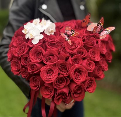 Heart Box - This romantic arrangement features vibrant red roses paired with elegant white orchids, beautifully styled in a heart-shaped box. The bold contrast of colors creates a dramatic and timeless look, perfect for expressing deep love, admiration, and affection.
Accented with delicate decorative butterflies, this composition is both emotional and eye-catching. Whether it’s for an anniversary, a proposal, or simply a grand romantic gesture, this floral design is made to impress and be remembered. Heart Box - This romantic arrangement features vibrant red roses paired with elegant white orchids, beautifully styled in a heart-shaped box. The bold contrast of colors creates a dramatic and timeless look, perfect for expressing deep love, admiration, and affection.
Accented with delicate decorative butterflies, this composition is both emotional and eye-catching. Whether it’s for an anniversary, a proposal, or simply a grand romantic gesture, this floral design is made to impress and be remembered.