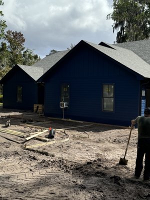 Driveway installed 2024 - This driveway was added to a home in Orange park that was getting remodeled. We did the dirt work with a skid steer getting the dirt removed and hauled off so we could continue to form. The driveway was around 1800 square feet. We poured a step and some sidewalk around the side of the house and to the front door. We also added a Trench Drain into the driveway to capture any water that was falling away from the house. The whole project too 3 days and the customer was very happy with the results. Driveway installed 2024 - This driveway was added to a home in Orange park that was getting remodeled. We did the dirt work with a skid steer getting the dirt removed and hauled off so we could continue to form. The driveway was around 1800 square feet. We poured a step and some sidewalk around the side of the house and to the front door. We also added a Trench Drain into the driveway to capture any water that was falling away from the house. The whole project too 3 days and the customer was very happy with the results.