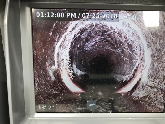 Installing Sewer Liners - During this job we effectively replaced all underground clay sewer pipes with a Liner System. We accomplish this by making one small excavation and inserting a sleeve permeated with epoxy resin. When the resin cures after 2-4 hours, voila, a brand new sewer pipe inside the old pipe. This is faster and less destructive than digging up the entire sewer line by hand. Also saves any hardscaping, landscaping decorative pavers that might be on top of the sewer.