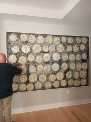 Giant Picture Hung Perfectly! - This 10-foot painting was painted by the mother of one of our clients. And she passed away as her son and daughter-in-law were moving into their new apartment in Durham. So we suggested the area in their new home to hang the painting and mounted in on special brackets so it's safe for as long as they live. Our clients are always very happy with our work. Giant Picture Hung Perfectly! - This 10-foot painting was painted by the mother of one of our clients. And she passed away as her son and daughter-in-law were moving into their new apartment in Durham. So we suggested the area in their new home to hang the painting and mounted in on special brackets so it's safe for as long as they live. Our clients are always very happy with our work.