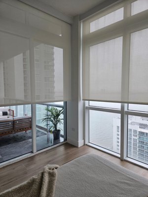 Double Shades in Downtown Miami High-rise - This high-rise apartment located in Downtown Miami wanted to reduce glare and increase room darkness for the bedroom. ShadeMonster's custom motorized double shades were the perfect window treatment solution. Transition from day to night with a touch of a button to adjust between your solar and blackout shades. Call today to get started on your own custom window treatment solution. Double Shades in Downtown Miami High-rise - This high-rise apartment located in Downtown Miami wanted to reduce glare and increase room darkness for the bedroom. ShadeMonster's custom motorized double shades were the perfect window treatment solution. Transition from day to night with a touch of a button to adjust between your solar and blackout shades. Call today to get started on your own custom window treatment solution.