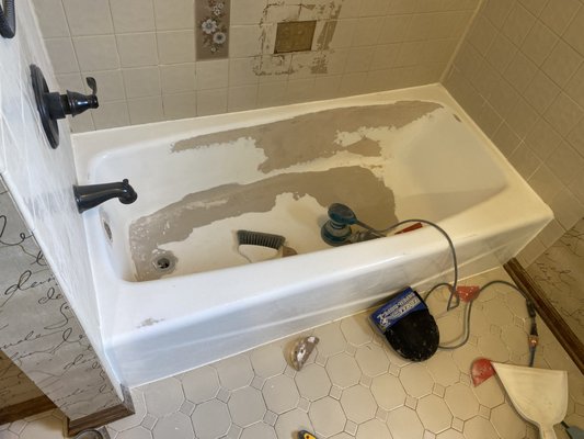 Stripping old finish from bathtub - This refinish was done on an old porcelain bathtub that had chipped paint from previous refinish job. Stripping old finish from bathtub - This refinish was done on an old porcelain bathtub that had chipped paint from previous refinish job.