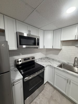Modern Apartment Remodel
in Northbrook, IL - Modern Apartment Remodel in Northbrook, IL | Kitchen & Bathroom Renovation by Renova Tiles & Remodeling
This apartment remodeling project in Northbrook, Illinois included a complete interior renovation designed to modernize the space and prepare the unit for new tenants. Renova Tiles & Remodeling completed a full kitchen remodel, bathroom upgrade, flooring installation, drywall repair, painting, electrical updates, and custom finishing work throughout the apartment.
The kitchen renovation included brand-new kitchen cabinets, new countertops, a modern backsplash installation, new kitchen flooring, and installation of all new appliances including a refrigerator, microwave, and dishwasher. New ceiling lights were installed in both the kitchen and bathroom to improve lighting and functionality. The electrical outlets in the kitchen and living room were also replaced for a cleaner and updated appearance.
The bathroom remodeling portion of the project included installation of a new Delta EverEdge bathtub along with repairs, painting, lighting upgrades, and detailed finishing work to create a clean and modern bathroom design.
Additional apartment renovation work included drywall repairs, full interior painting, closet framing adjustments for new closet doors, trim installation, ceiling improvements, and detailed finishing touches throughout the unit.
Renova Tiles & Remodeling specializes in apartment renovations, kitchen remodeling, bathroom remodeling, tile installation, flooring installation, drywall repair, painting, and rental property renovations in Northbrook, Waukegan, Gurnee, Libertyville, Lake Forest, Skokie, and surrounding Chicagoland areas.
📞 224-369-8315
🌐 Renova Tiles & Remodeling Modern Apartment Remodel
in Northbrook, IL - Modern Apartment Remodel in Northbrook, IL | Kitchen & Bathroom Renovation by Renova Tiles & Remodeling
This apartment remodeling project in Northbrook, Illinois included a complete interior renovation designed to modernize the space and prepare the unit for new tenants. Renova Tiles & Remodeling completed a full kitchen remodel, bathroom upgrade, flooring installation, drywall repair, painting, electrical updates, and custom finishing work throughout the apartment.
The kitchen renovation included brand-new kitchen cabinets, new countertops, a modern backsplash installation, new kitchen flooring, and installation of all new appliances including a refrigerator, microwave, and dishwasher. New ceiling lights were installed in both the kitchen and bathroom to improve lighting and functionality. The electrical outlets in the kitchen and living room were also replaced for a cleaner and updated appearance.
The bathroom remodeling portion of the project included installation of a new Delta EverEdge bathtub along with repairs, painting, lighting upgrades, and detailed finishing work to create a clean and modern bathroom design.
Additional apartment renovation work included drywall repairs, full interior painting, closet framing adjustments for new closet doors, trim installation, ceiling improvements, and detailed finishing touches throughout the unit.
Renova Tiles & Remodeling specializes in apartment renovations, kitchen remodeling, bathroom remodeling, tile installation, flooring installation, drywall repair, painting, and rental property renovations in Northbrook, Waukegan, Gurnee, Libertyville, Lake Forest, Skokie, and surrounding Chicagoland areas.
📞 224-369-8315
🌐 Renova Tiles & Remodeling