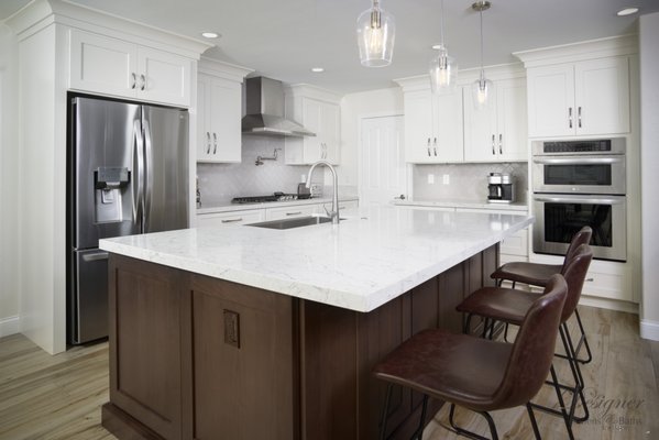 Whitney Ranch - This Kitchen was dated with gold oak cabinets, tile countertops etc. The layout was not functional at all. We did a complete removal of the old kitchen. Designed the new layout that works best for their family functions.