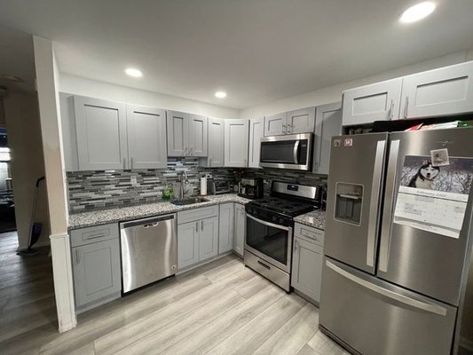 Kitchen Remodel - Installed new vinyl luxury plank flooring, updated appliances, new cabinetry, countertops, and backsplash. Kitchen Remodel - Installed new vinyl luxury plank flooring, updated appliances, new cabinetry, countertops, and backsplash.