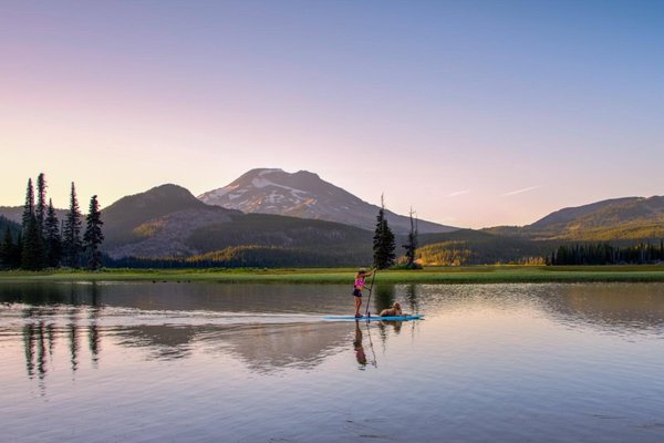 Paddle Boarding in Cascade Lakes - Paddle Boarding in Cascade Lakes
125/person    3 hours 

Explore the magical beauty of the Cascade Lakes via paddle board soaking in the snow-capped mountains in the background.  This will be an intimate group (limit 4 people) so that we can maximize our time in these incredible surroundings.

We will pick one of a few lake options that will be far less crowded than where most of the Bend tourists visit.  When you are not paddle boarding, feel free to relax under our canopy or take a dip in the refreshing waters of the Cascade Lakes. Want to play a game of horse shoes in between paddle sessions?  No problem!  It’s your day to paddle, swim, relax – and of course, enjoy the stunning scenery.

What is Included from ATB:

Paddle board & Paddle for each guest
Life Jacket (if you choose to wear one)
Dry Bag (primarily for your camera while you are on the water, but can be used for many more items)
Artisan Lunch
Beverages
Parking Fee
What ATB suggests you bring:

Sunscreen
Layers (weather can change quickly in this area
Towel
Lake Shoes (do not worry if you only have flip flops or other type of shoes)
Water