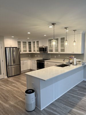Kitchen remodel - We removed two walls separating a rarely used dining room and enlarged the kitchen, updated the cabinets with all wood cabinets, quartz tops and a custom designed backsplash Kitchen remodel - We removed two walls separating a rarely used dining room and enlarged the kitchen, updated the cabinets with all wood cabinets, quartz tops and a custom designed backsplash