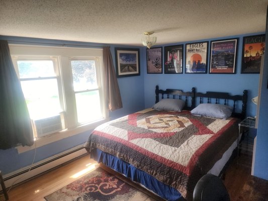 Guest Bedroom Refresh - This guest room went from plain white and forgettable to warm and full of character. We painted the walls a bold blue and built the whole design around a handmade quilt made by the client's mother — turning a keepsake that was tucked away into the heart of the room.
Sometimes the best design element is something you already own.