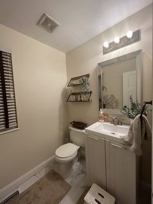 Half Bath Repaint - Our customer wanted a fresh new look in their bathroom. Previously a deep blue color, we applied SW steamed milk in 3 coats for full coverage. It turned out it so beautiful!