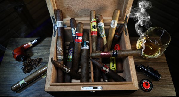 Walk in Humidor with Premium Cigars - Any cigar expert knows the importance of storing cigars in a humidity-controlled space. Fairhaven Smoke Shop keeps our selection of over 150 boxes of high-end cigars stored in a humidor to maintain their freshness until you're ready to make your purchase. We offer a wide variety of premium high end cigars to your everyday smoke.
Our humidor is fully stocked with some premier brands such as:
Cohiba
Drew Estate
JFR
Macanudo
Montecristo
Padron
Perdomo
And many more...
Come visit our full-sized climate controlled humidor today! Walk in Humidor with Premium Cigars - Any cigar expert knows the importance of storing cigars in a humidity-controlled space. Fairhaven Smoke Shop keeps our selection of over 150 boxes of high-end cigars stored in a humidor to maintain their freshness until you're ready to make your purchase. We offer a wide variety of premium high end cigars to your everyday smoke.
Our humidor is fully stocked with some premier brands such as:
Cohiba
Drew Estate
JFR
Macanudo
Montecristo
Padron
Perdomo
And many more...
Come visit our full-sized climate controlled humidor today!