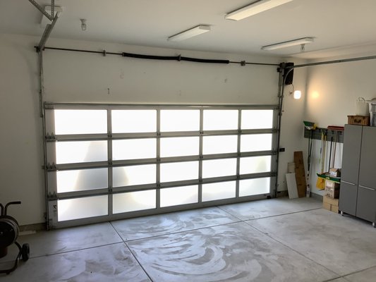 High Lift Conversion - We came out to the home of one of our valued customers. He had an existing full view (BEAUTIFUL) garage door. He had a standard tracking system on it, however he wanted it to be converted to a high lift tracking system. This would the door to be opened at a much higher height, allowing for that space to be utilized for the customer's needs. High Lift Conversion - We came out to the home of one of our valued customers. He had an existing full view (BEAUTIFUL) garage door. He had a standard tracking system on it, however he wanted it to be converted to a high lift tracking system. This would the door to be opened at a much higher height, allowing for that space to be utilized for the customer's needs.
