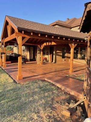 Pergola and floor addition - Client had an old patio with a wood floor and no pergola. We have removed the old patio floor, did a concrete floor with stain and stamping and built a pergola from Western Red Cedar.