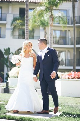 Katelyn and Daniel had the wedding of their dreams! - Katelyn and Daniel had the wedding of their dreams! Check out these beautiful wedding photos at the Hyatt Regency Huntington Beach Resort and Spa, Los Angeles, California. Being a part of the beautiful sunny outdoor ceremony was surely a highlight moment for everyone who attended.
Her gorgeous blonde hair hung down in loose bouncy curls and was perfectly held in place by shimmering clips which paired nicely with her diamond teardrop earrings.
Daniel decided to go with a classic white and navy blue pairing that involved a bright white dress shirt, equally vibrant white tie and pocket square, dark navy blue suit jacket and pants, and a pair of brown dress shoes that gave him a timeless look.
When picking a location for an ideal wedding, it’s hard to find one that provides more luscious scenery than Huntington Beach Los Angeles.
The fact that their wedding took place at the Hyatt Regency in Huntington Beach meant that Katelyn and Daniel had plenty of opportunities to take advantage of the elegant artwork and structures that can only be found at high-end hotels. The beautiful tiered fountain at the front of the building was the ultimate architectural highlight without outshining the lovely couple on their special day.
The ceremony took place on the back lawn and was perfectly positioned so that the majestic stretch of ocean was the couple’s backdrop. Simple white folding chairs lined the lawn in a straight line towards the altar, leaving a path for the elegantly dressed bridal party to walk down.
The reception had many spectacular moments. The entire room was filled with meaningful accessories including a tile dance floor in the middle of the room, an engraved hatchet to represent Daniel’s brave role as a firefighter, and a lovely four-tier wedding cake with white frosting, pink flowers to accentuate it, and a silhouette wedding topping of a firefighter kissing a woman.
It was in this room that Katelyn and Daniel danced the night away and ended the big celebration with a champagne toast to their new status as a married couple. Katelyn and Daniel had the wedding of their dreams! - Katelyn and Daniel had the wedding of their dreams! Check out these beautiful wedding photos at the Hyatt Regency Huntington Beach Resort and Spa, Los Angeles, California. Being a part of the beautiful sunny outdoor ceremony was surely a highlight moment for everyone who attended.
Her gorgeous blonde hair hung down in loose bouncy curls and was perfectly held in place by shimmering clips which paired nicely with her diamond teardrop earrings.
Daniel decided to go with a classic white and navy blue pairing that involved a bright white dress shirt, equally vibrant white tie and pocket square, dark navy blue suit jacket and pants, and a pair of brown dress shoes that gave him a timeless look.
When picking a location for an ideal wedding, it’s hard to find one that provides more luscious scenery than Huntington Beach Los Angeles.
The fact that their wedding took place at the Hyatt Regency in Huntington Beach meant that Katelyn and Daniel had plenty of opportunities to take advantage of the elegant artwork and structures that can only be found at high-end hotels. The beautiful tiered fountain at the front of the building was the ultimate architectural highlight without outshining the lovely couple on their special day.
The ceremony took place on the back lawn and was perfectly positioned so that the majestic stretch of ocean was the couple’s backdrop. Simple white folding chairs lined the lawn in a straight line towards the altar, leaving a path for the elegantly dressed bridal party to walk down.
The reception had many spectacular moments. The entire room was filled with meaningful accessories including a tile dance floor in the middle of the room, an engraved hatchet to represent Daniel’s brave role as a firefighter, and a lovely four-tier wedding cake with white frosting, pink flowers to accentuate it, and a silhouette wedding topping of a firefighter kissing a woman.
It was in this room that Katelyn and Daniel danced the night away and ended the big celebration with a champagne toast to their new status as a married couple.
