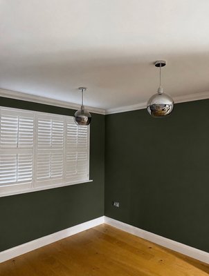 Interior Painting Project - This interior painting project transformed the room with a rich olive green color and a smooth matte finish. We carefully prepared the surfaces, repaired imperfections, and applied premium paint to achieve crisp edges and even coverage throughout the space. The contrast between the deep wall color, white trim, and natural wood flooring creates a modern and elegant atmosphere. Interior Painting Project - This interior painting project transformed the room with a rich olive green color and a smooth matte finish. We carefully prepared the surfaces, repaired imperfections, and applied premium paint to achieve crisp edges and even coverage throughout the space. The contrast between the deep wall color, white trim, and natural wood flooring creates a modern and elegant atmosphere.