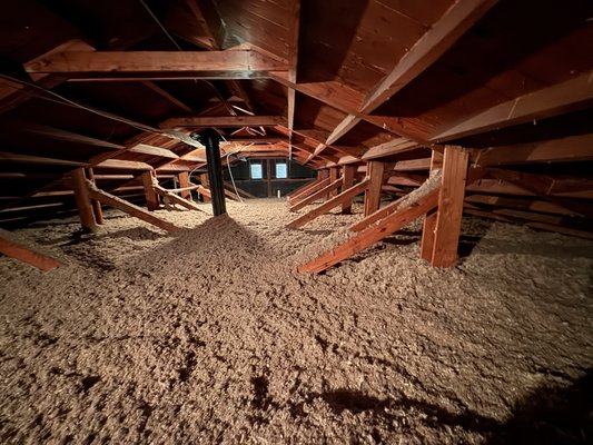 Attic Insulation in progress. - Adding an r-49 of Sanctuary insulation to an attic floor.