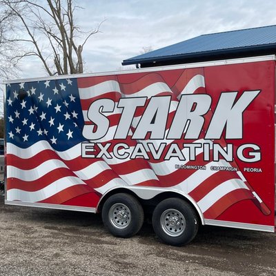 Stark Excavating - Stark Excavating Fleet Wrap — Chicago Fleet Wraps Case Study
Stark Excavating is a heavy civil contractor running excavation, concrete, asphalt, and site development across central Illinois and the Chicago region. They came to Chicago Fleet Wraps for branding on equipment most contractors leave bare: trailers and concrete mixer barrels.
This is what we did.
The Starting Point
Stark Excavating had brand recognition with general contractors and municipalities. They didn't have brand presence on the equipment itself.
Excavation contractors live and die on jobsite visibility. A Stark trailer outside a road project, a Stark mixer rolling concrete to a foundation pour, a Stark dump truck staged at a subdivision build — every one of those is seen by other contractors, project managers, homeowners watching construction, and competitors scoping the work.
The math: a mixer barrel rotates roughly 1,200 times per pour. Four to eight pours per day, 200 working days per year. The barrel is a billboard that spins in front of the customer for every pour. Trailers at jobsites work the same way — static signage in front of every neighbor and subcontractor.
What CFW Did
Production and install of branded wraps on Stark Excavating trailers and concrete mixer barrels. Stark supplied the design. We handled prep, print, and install for two of the toughest substrates in the industry.
The Trailer Job
Trailers aren't standard wrap surfaces. Heavy gauge steel. Rivets every 12 inches. Diamond plate sections. Years of road grime and salt embedded in the panels.
Pre-install prep took longer than the install. Power-wash, isopropyl decon, rust treatment, diamond plate masking. Rivets heat-formed individually after the wrap was laid — vinyl that bridges over a rivet without being pressed into the head lifts inside 6 months.
Material: Avery Dennison MPI 1105 cast vinyl with DOL 1460 overlaminate. Cast is non-negotiable on a trailer. The compound curves, rivet pattern, and edge seams demand a film that conforms without memory. Calendared vinyl shrinks back. Cast doesn't.
The Concrete Mixer Barrel Job
Mixer barrels are the hardest wrap surface in the industry. Rotating drum, constant abrasion from concrete and aggregate, water and chemical exposure, freeze-thaw cycling, and a curved surface that's never the same diameter twice.
Most shops won't take this work. The ones that do usually deliver wraps that fail in 12 months.
We use 3M IJ180-CV3 with 8519 overlaminate on barrels. Higher abrasion resistance than the trailer spec, paired with the heaviest-duty cast overlaminate 3M produces. The system handles Stark's operating conditions: rotating, abrasive, wet, chemically loaded.
Install required heating the barrel to 90°F before applying vinyl. Cold barrel plus cast film equals poor tack. We staged it in our heated bay for 4 hours, applied the wrap clean, post-heated to 220°F to lock conformity, edge-sealed every panel break.
Print: HP Latex  at our Portage Park facility. Latex inks bond deeper than solvent — important when concrete abrades the surface daily.
The Outcome
Stark Excavating now operates branded equipment that does what bare equipment can't:
Builds project-site visibility. Every jobsite with Stark equipment becomes a branded presence. Homeowners see Stark trailers for weeks during street rebuilds. Other contractors see them daily on multi-trade jobs. Both convert to referrals.
Generates rotating impressions during pours. Mixer barrels are working signage. Every delivery puts the brand in front of the customer for the full pour — 30 to 60 minutes of branded visibility per delivery, thousands of times per year per truck.
Differentiates Stark in fleet staging. Branded equipment looks more professional than bare. Project managers notice. General contractors notice. It influences who gets called for the next phase.
Why This Project Matters
Trailer and mixer barrel wraps are work most Chicago wrap shops avoid. Difficult substrates. Slow install. Higher material cost. Thinner margins than wrapping a Sprinter van.
Chicago Fleet Wraps takes this work because we have 25 years of install experience and the materials inventory to handle it. Stark got their fleet branded on equipment most competitors leave blank. Every Stark vehicle on a jobsite generates recognition the unbranded competitor next to it isn't.
That's the compounding effect of doing the work right on the equipment most shops won't touch.
Project Details
Client: Stark Excavating
Equipment: Trailers and concrete mixer barrels
Shop: Chicago Fleet Wraps, 4711 N Lamon Ave #7, Chicago, IL 60630
Trailer materials: Avery Dennison MPI 1105 + DOL 1460
Barrel materials: 3M IJ180-CV3 + 3M 8519
Print: HP Latex 700W
Service area: Chicago, Cook County, central Illinois
Type: Print + install (design supplied by client)
Chicago Fleet Wraps
4711 N Lamon Ave #7, Chicago, IL 60630
(312) 597-1286
chicagofleetwraps.com