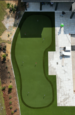 Poolside Putting Green in Jackson, MS - This residential project in Jackson, MS included a total of 3,000 sq/ft of SYNAugustineX47 for the lawn, Precision Putt golf turf, and SYNRye 200 for the thin collar on the green! These three artificial turf options were chosen thanks to their exceptional durability, beauty, and fade resistance. SYNLawn turf is designed to last a lifetime with minimal effort saving time and money. In addition, SYNLawn is the leading provider of Indiana putting green turf, offering PGA-caliber performance. We've partnered with former NASA engineer and professional golf coach Dave Pelz to ensure our golf greens replicate the look and feel of real grass as closely as possible. Poolside Putting Green in Jackson, MS - This residential project in Jackson, MS included a total of 3,000 sq/ft of SYNAugustineX47 for the lawn, Precision Putt golf turf, and SYNRye 200 for the thin collar on the green! These three artificial turf options were chosen thanks to their exceptional durability, beauty, and fade resistance. SYNLawn turf is designed to last a lifetime with minimal effort saving time and money. In addition, SYNLawn is the leading provider of Indiana putting green turf, offering PGA-caliber performance. We've partnered with former NASA engineer and professional golf coach Dave Pelz to ensure our golf greens replicate the look and feel of real grass as closely as possible.