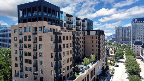 Downtown Dallas Window & Door Supply - Brennan supplied the windows and exterior doors for this stunning luxury apartment building. The design team for this building received multiple bids but ultimately chose ours making this our biggest Andersen windows and doors project in the history of our company and one of the largest Andersen projects in the state of Texas at the time. For this project we supplied Andersen Fibrex windows (100 Series), Andersen Fibrex sliding doors, and Andersen E-Series swing doors with glass, all in dark bronze interior and exterior finishes.