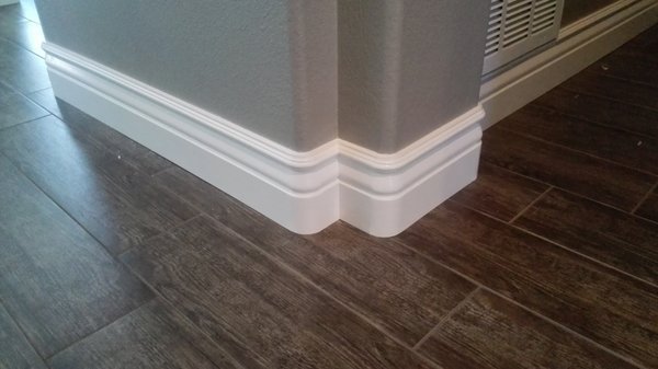 Baseboards - A few of the many Baseboard projects we've completed throughout the years.
5 inch baseboards have largely become the standard upgrade in recent times, regardless of ceiling height. Some with 8 foot ceilings do prefer a smaller 4 inch baseboard, while higher ceilings will likely want to opt for something in the 6 inch range or even taller.
It's a good idea to match your baseboards with the door casing it'll be going up against, but it isn't uncommon for some homeowners to choose something a little off the beaten path. After all, there are no rules in art. Baseboards - A few of the many Baseboard projects we've completed throughout the years.
5 inch baseboards have largely become the standard upgrade in recent times, regardless of ceiling height. Some with 8 foot ceilings do prefer a smaller 4 inch baseboard, while higher ceilings will likely want to opt for something in the 6 inch range or even taller.
It's a good idea to match your baseboards with the door casing it'll be going up against, but it isn't uncommon for some homeowners to choose something a little off the beaten path. After all, there are no rules in art.