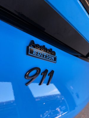 Porsche 911 - This Porsche 911 was fully wrapped by us, chrome delete, ceramic tints all around, ghost tints on headlights and tinted tail lights.