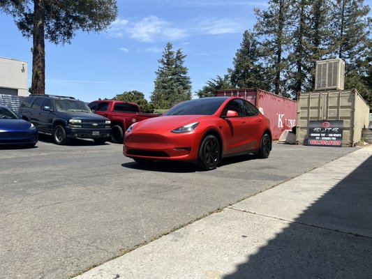 Vinyl Wrap - We did a complete color change on this 2022 Tesla Model Y 
From White to Red 
We also ceramic coated the whole car and tinted the windows.