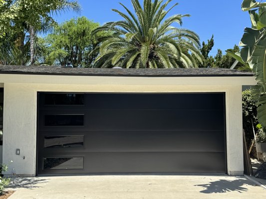Calabasas Modern - This client wanted a very modern looking door. We found this smooth flush door from AlumaDoor at an unbelieveably good price and it was a perfect fit. Both the contractor and homeowner were thrilled! The Liftmaster Belt Drive operator we installed runs this door incredibly quiet and smooth. Calabasas Modern - This client wanted a very modern looking door. We found this smooth flush door from AlumaDoor at an unbelieveably good price and it was a perfect fit. Both the contractor and homeowner were thrilled! The Liftmaster Belt Drive operator we installed runs this door incredibly quiet and smooth.