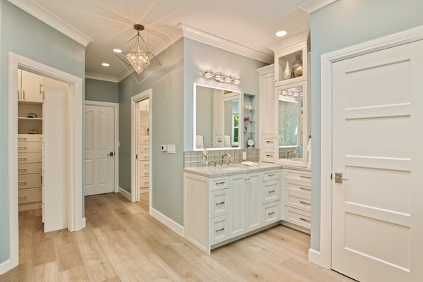 Oak Knoll Bathroom - Our clients wanted improve the style and layout of their master bath for better storage and a modern look. We removed their carpet and tile, and installed waterproof SPC flooring. We built them a master bath with a custom layout that included a shower, two walk-in closets, and a "His" and "Hers" vanity. Oak Knoll Bathroom - Our clients wanted improve the style and layout of their master bath for better storage and a modern look. We removed their carpet and tile, and installed waterproof SPC flooring. We built them a master bath with a custom layout that included a shower, two walk-in closets, and a "His" and "Hers" vanity.