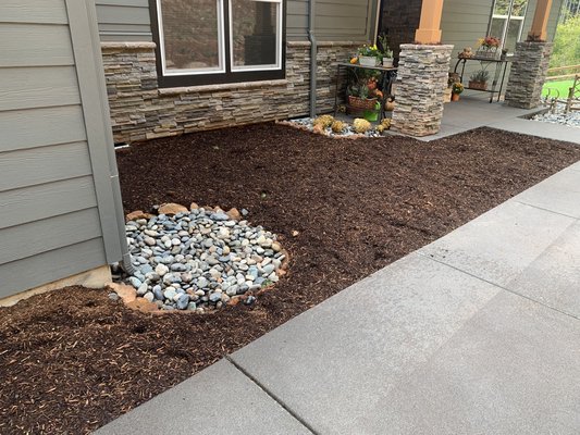 Low maintenance river rock and bark dust transformation. - Daniel V. Landscaping recently enhanced a property in Camas, WA with the installation of river rock and bark dust, creating a striking and low-maintenance landscape. Our team expertly arranged the river rock to provide both visual appeal and functional ground cover, while the bark dust added a natural, polished look to garden beds and walkways. This combination not only improves the property's aesthetics but also helps with soil moisture retention and weed control. If you're in Camas, WA, and looking for professional river rock and bark dust installation, Daniel V. Landscaping offers the expertise to elevate your outdoor space with style and practicality.