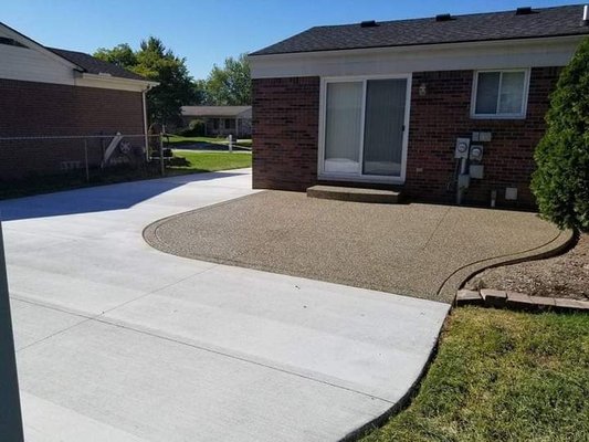 White Concrete driveway with custom exsposed aggregate patio area - We offer Custom concrete driveway and patio work. Pool decks, walkways, sidewalks, poured in place concrete countertops an much more. White Concrete driveway with custom exsposed aggregate patio area - We offer Custom concrete driveway and patio work. Pool decks, walkways, sidewalks, poured in place concrete countertops an much more.