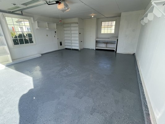 Garage refresh - The customer was looking for just some painting on walls , to remove that ugly old green, but we end up doing restoration in all damaged drywall, repainting cabinets and grinding and epoxy on floors