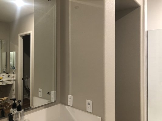 In wall medicine cabinet installation. - This medicine cabinet was installed in a finished bathroom. The hole was measured, drawn, leveled, and cut out. After removing he Sheetrock, studs had to be removed from the wall using an oscillating multi tool. After the space was prepped, the cabinet was inserted, leveled, and secured in place.