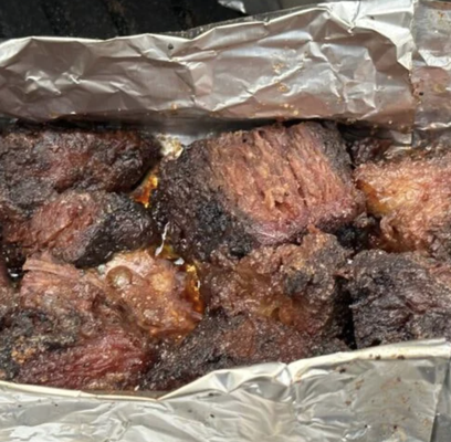 BEEF BRISKET BURNT ENDS - Kansas City-style burnt ends feature crispy, bark-crusted cubes of brisket point, slow-smoked then tossed in thick, sweet-tangy molasses BBQ sauce for caramelized, meat-candy perfection—a true pitmaster's treat for barbecue enthusiasts.