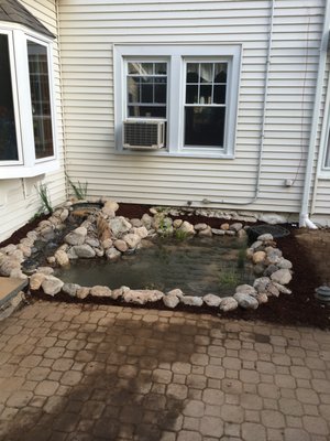 Small 8' x 6' pond in Stonington, CT - Client called and wanted a small pond next to a patio where there was too much shade for any plants to grow. TJB-INC designed and built a small pond with a short stream that has crystal clear water. Small 8' x 6' pond in Stonington, CT - Client called and wanted a small pond next to a patio where there was too much shade for any plants to grow. TJB-INC designed and built a small pond with a short stream that has crystal clear water.