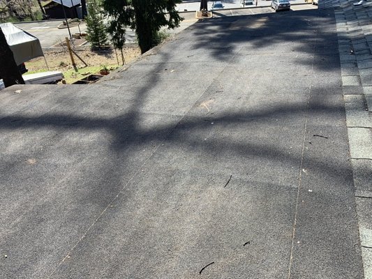 Flat deck reroof - Remove and replace existing roof membrane and repair water damage. Flat deck reroof - Remove and replace existing roof membrane and repair water damage.