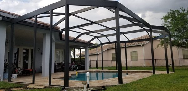 New Screen Enclosure in 2020 - This beautiful cage is one of my favorites! It was custom built with many degrees, a gable roof in the center with a compound miter cut. A great looking custom screen enclosure in Waterways community with a beautiful view of the lake. For more information visit our website at www.AFScreenRepair.com or call us at (239)250-3828. New Screen Enclosure in 2020 - This beautiful cage is one of my favorites! It was custom built with many degrees, a gable roof in the center with a compound miter cut. A great looking custom screen enclosure in Waterways community with a beautiful view of the lake. For more information visit our website at www.AFScreenRepair.com or call us at (239)250-3828.