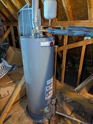 Water Heater in Attic - Arrived on site and drained existing water heater from the attic, disconnecting water supply, gas supply, and venting. Also removed the drain pan. Installed new drain pan with 50 gallon gas water heater. Made all appropriate connections using all copper for The water inlet and outlet. Installed an ion 6 water conditioner on the inlet with a new ball valve and with a new thermal expansion tank. Perform startup procedures and tested confirming proper functionality, cleaned up area of work before departing. Water Heater in Attic - Arrived on site and drained existing water heater from the attic, disconnecting water supply, gas supply, and venting. Also removed the drain pan. Installed new drain pan with 50 gallon gas water heater. Made all appropriate connections using all copper for The water inlet and outlet. Installed an ion 6 water conditioner on the inlet with a new ball valve and with a new thermal expansion tank. Perform startup procedures and tested confirming proper functionality, cleaned up area of work before departing.