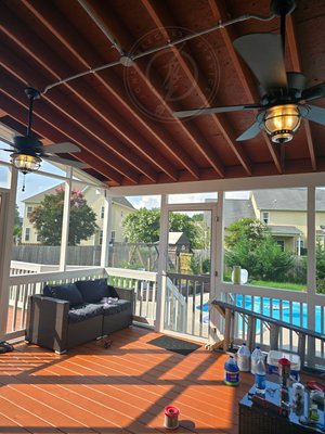 Back Deck Fans - This was a new build for a client. They had the deck built and paint and decided they needed outlets, lighting, and fans. The work turned out nicely. Added a new 20A circuit for four (4) NEW GFCI outlets. Removed the exterior light by the door and installed an extension box and pvc conduit run, T'ing off to location of two (2) ceiling fans with extended down rods. Inside (not shown), installed (2) smart switches with remotes to control either fan or lights. Back Deck Fans - This was a new build for a client. They had the deck built and paint and decided they needed outlets, lighting, and fans. The work turned out nicely. Added a new 20A circuit for four (4) NEW GFCI outlets. Removed the exterior light by the door and installed an extension box and pvc conduit run, T'ing off to location of two (2) ceiling fans with extended down rods. Inside (not shown), installed (2) smart switches with remotes to control either fan or lights.