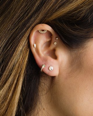 Curated Ear Piercing Stacks - Find your new favorite stud and get it pierced anywhere on your ear from our certified in-store piercer, available for appointments or walk-ins every Wednesday - Sunday. Our sales specialists will help you curate the perfect ear stack with our signature 14K gold + diamond earrings, designed with flat backs for extra comfort and ease with healing. Book your appointment now. Curated Ear Piercing Stacks - Find your new favorite stud and get it pierced anywhere on your ear from our certified in-store piercer, available for appointments or walk-ins every Wednesday - Sunday. Our sales specialists will help you curate the perfect ear stack with our signature 14K gold + diamond earrings, designed with flat backs for extra comfort and ease with healing. Book your appointment now.