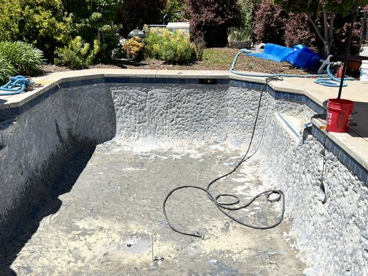 Old pool made new with long life products. - This pool was rough with plaster stains. Full chip out to make way for new plaster bonding. New tile, glass trim tiles is a beautiful touch. Let us help you make that old pool new again. Old pool made new with long life products. - This pool was rough with plaster stains. Full chip out to make way for new plaster bonding. New tile, glass trim tiles is a beautiful touch. Let us help you make that old pool new again.