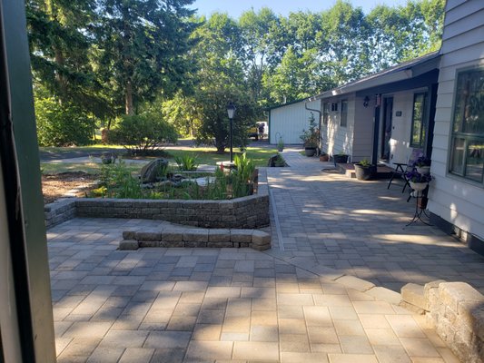 Front yard install - Functional curb appeal
Paver driveway and front patio with garden wall and natural bubbling rock water feature Front yard install - Functional curb appeal
Paver driveway and front patio with garden wall and natural bubbling rock water feature