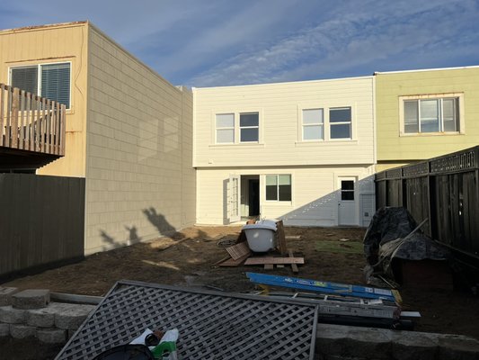 Exterior House Painting - We painted the back of the exterior of this house since the client wanted to  remodel the whole back yard. We power washed, prep, prime and apply 2 coats of finish paint on the house, shed and fences