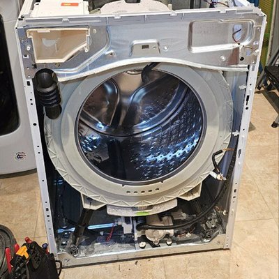 Washer Door Boot Gasket Replacement - This washer was leaking water due to a torn door boot gasket. Our technician disassembled the unit, removed the damaged gasket, and installed a new factory replacement. After reassembly and testing, the washer was fully restored with no leaks and ready for daily use.