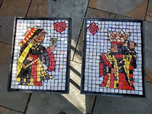 King and Queen Card Tables - This client came to me with 2 small ceramic mosaic pieces: a king of diamonds and a queen of hearts. She wanted to incorporate them into two outdoor tables. The mosaic pieces had been originally made by her grandfather and were over 50 years old. They were very special to the client but they were also very water damaged. I had to completely dismantle the originals and rebuild them from scratch. Some pieces were missing so I researched what traditionally the card images included and made adjustments. I replaced the Queen's missing flower and make make adjustments to the King's sword. After I built the mosaics, they were then built into the two tables. The client was very pleased and touched with how they came out. I was too. King and Queen Card Tables - This client came to me with 2 small ceramic mosaic pieces: a king of diamonds and a queen of hearts. She wanted to incorporate them into two outdoor tables. The mosaic pieces had been originally made by her grandfather and were over 50 years old. They were very special to the client but they were also very water damaged. I had to completely dismantle the originals and rebuild them from scratch. Some pieces were missing so I researched what traditionally the card images included and made adjustments. I replaced the Queen's missing flower and make make adjustments to the King's sword. After I built the mosaics, they were then built into the two tables. The client was very pleased and touched with how they came out. I was too.