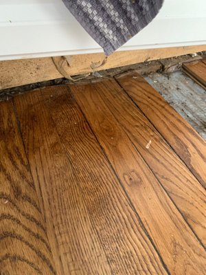 Flooring Damage Restoration - Virginia - Water Damage Restoration APS was fixing the damaged area under the hardwood flooring.