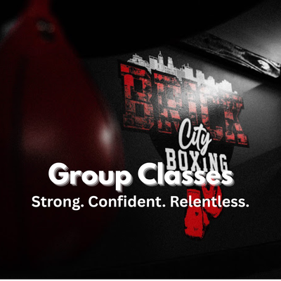 Group Classes - Our group classes combine real boxing technique, high-energy conditioning, and a supportive community that keeps you coming back. Led by experienced coaches, every class blends pad work, bag rounds, strength training, and cardio—designed to challenge all fitness levels without intimidation.
Whether you’re brand new to boxing or leveling up your training, you’ll get hands-on coaching, motivating music, and a full-body workout that builds strength, confidence, and mental toughness. Expect to sweat, learn real skills, and leave feeling accomplished—every single time.
No egos. No judgment. Just hard work, progress, and a community that pushes you to be better. Group Classes - Our group classes combine real boxing technique, high-energy conditioning, and a supportive community that keeps you coming back. Led by experienced coaches, every class blends pad work, bag rounds, strength training, and cardio—designed to challenge all fitness levels without intimidation.
Whether you’re brand new to boxing or leveling up your training, you’ll get hands-on coaching, motivating music, and a full-body workout that builds strength, confidence, and mental toughness. Expect to sweat, learn real skills, and leave feeling accomplished—every single time.
No egos. No judgment. Just hard work, progress, and a community that pushes you to be better.