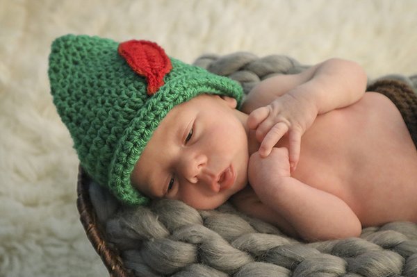 Newborn Session - Elijah - Baby Elijah just 3 weeks old dressed as Peter Pan. His mother is an Air Force veteran therefore we posed Elijah on a wooden US flag.