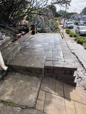 block retainer and pavers - This project was done to place trash cans and prevent the land from collapsing further.