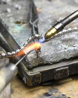 Jewelry Repair - D'Errico Jewelry was established on sincerity and the willingness to satisfy.
-
At D'Errico we combine old world craftsmanship modern technology with, resulting in a wonderful and comfortable jewelry experience. Minor scratches and broken chains shouldn’t keep you from wearing your favorite jewelry. We offer full-service repairs, from gem polishing to clasp replacement.
-
Ring resizing, clasp and chain repair, stone replacement, scratch removal, and watch repairs are just a few of the services we offer.
-
We will repair any jewelry whether you bought it at our store or not. 
-
WHILE YOU WAIT SERVICE
-
In our jewelry factory on the premise watch while you wait. Your valuable jewelry never has to leave your sight.
-
No job is too big or too small, we never say no!